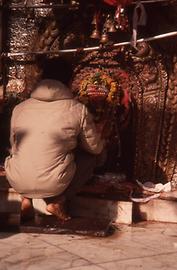 A pilgrim is decorating it A pilgrim is decorating it