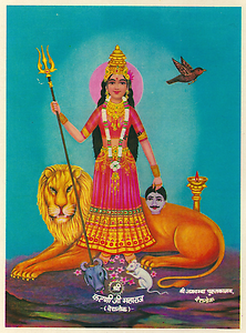Karni Devi as Durga with caption shri karniji maharaj deshnok. The small head of a buffalo at her feet refers to the skull of Yama Karni Devi as Durga with caption shri karniji maharaj deshnok. The small head of a buffalo at her feet refers to the skull of Yama