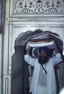 At midnight the holy book is taken in a ceremonial procession into a separate building where it is put to sleep At midnight the holy book is taken in a ceremonial procession into a separate building where it is put to sleep