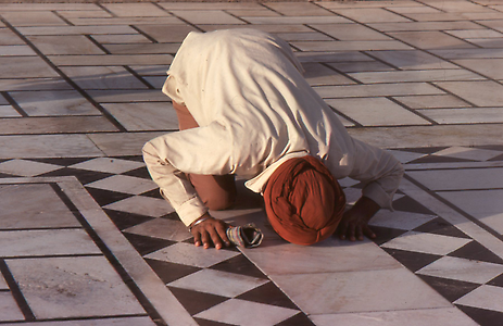 A prayer lying on the ground face down as sign of worship A prayer lying on the ground face down as sign of worship