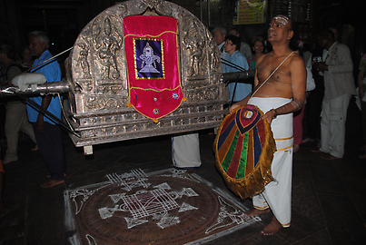 The litter is placed on a Mandala, which is elaborately painted with chalk on the floor The litter is placed on a Mandala, which is elaborately painted with chalk on the floor