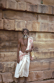 Sadhu with begging bowl in Sarnath near Varanasi / Benares, a prominent Buddhist pilgrimage site Sadhu with begging bowl in Sarnath near Varanasi / Benares, a prominent Buddhist pilgrimage site