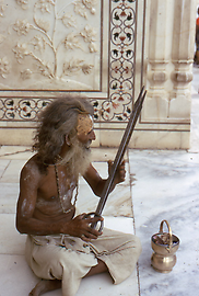 Some Agoris torment themselves by sitting down near a fireplace and stirring the fire with tongs Some Agoris torment themselves by sitting down near a fireplace and stirring the fire with tongs